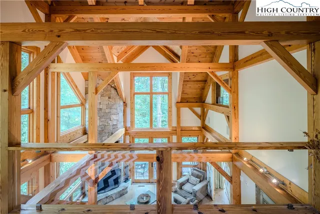 a view of a brick house with a small yard