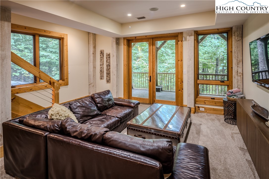 161 Hump View Trail Banner Elk, NC 28604 - Photo 46 of 50 a living room with furniture and large windows
