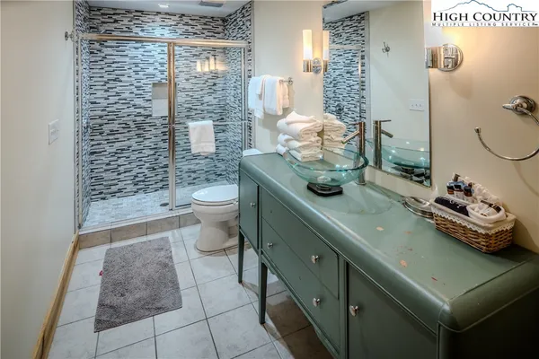 a bathroom with a tub and sink