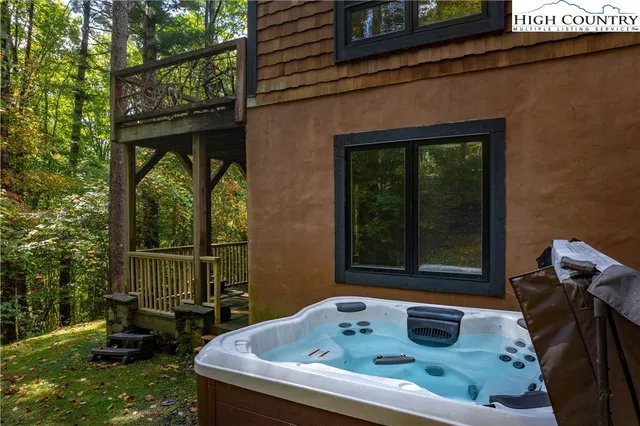 a view of a backyard with plants and a patio