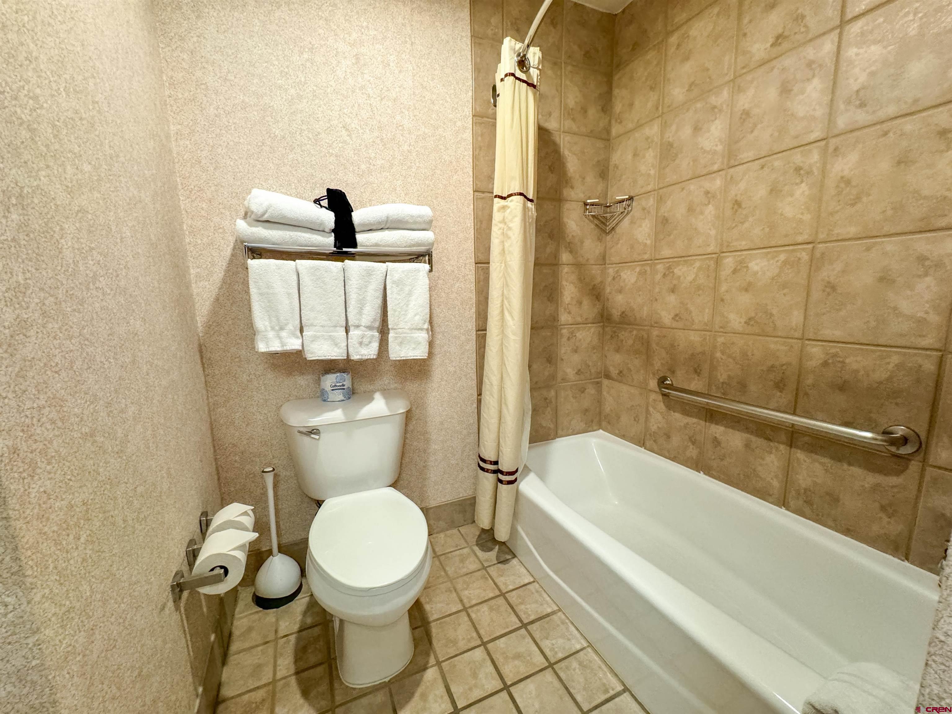 6 Emmons Road, Unit 181 Crested Butte, CO 81225 - Photo 13 of 25 a bathroom with a toilet and a bathtub