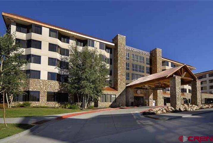 6 Emmons Road, Unit 181 Crested Butte, CO 81225 - Photo 25 of 25 a view of a tall building next to a yard