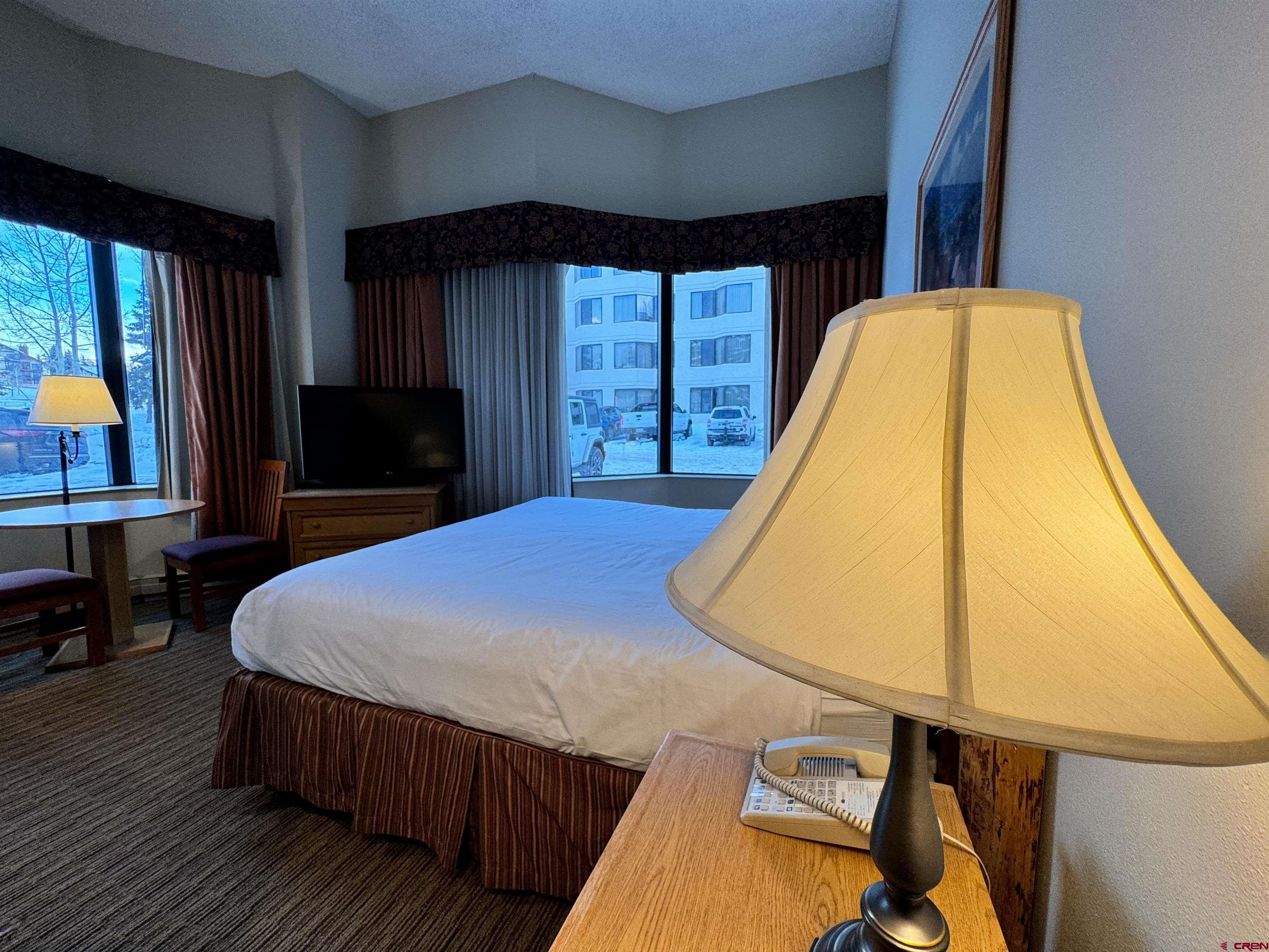 6 Emmons Road, Unit 181 Crested Butte, CO 81225 - Photo 9 of 25 a bed sitting in a bedroom next to a window