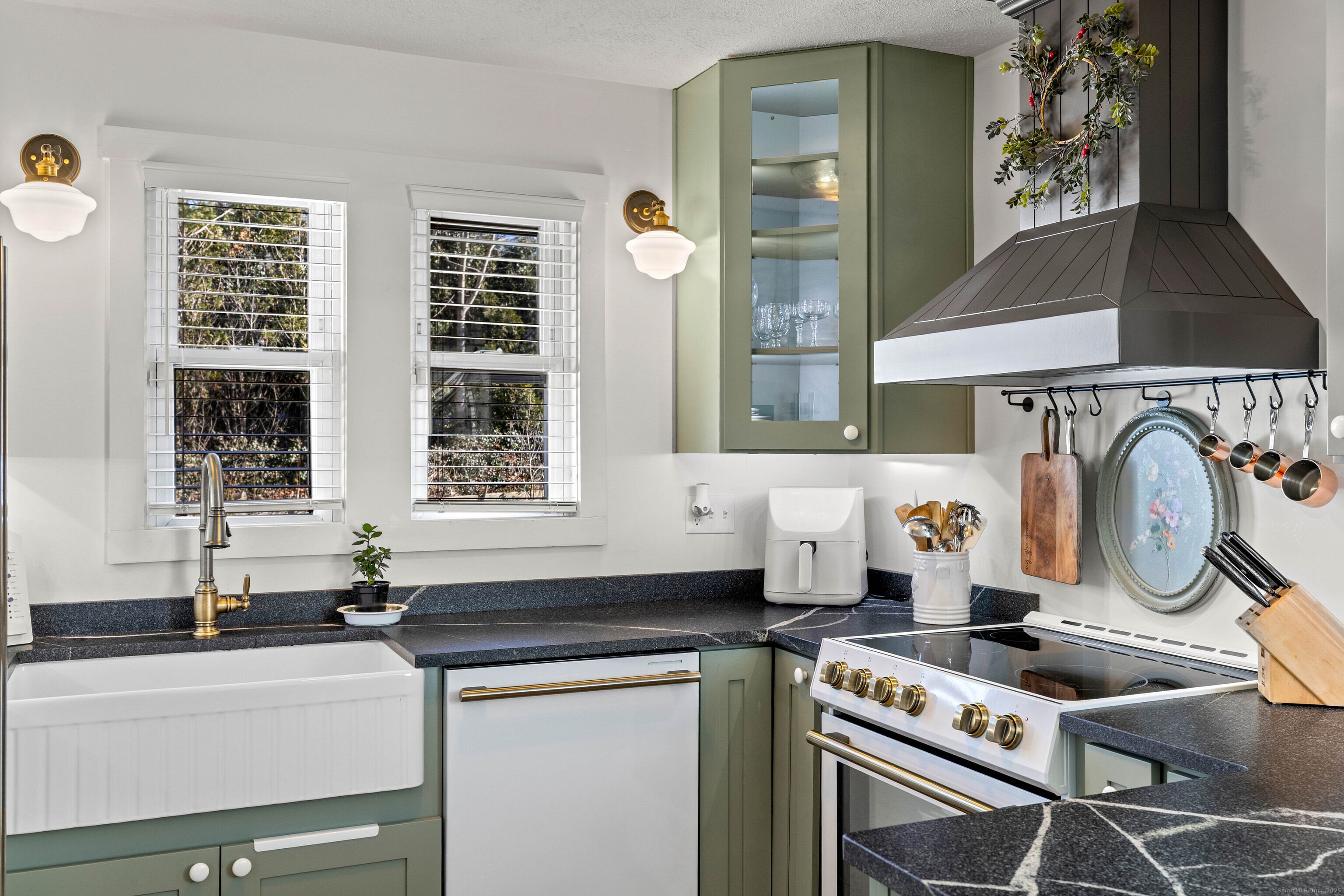 552 Laurel Hill Road Norwich, CT 06360 - Photo 11 of 40 a kitchen with a stove and a sink