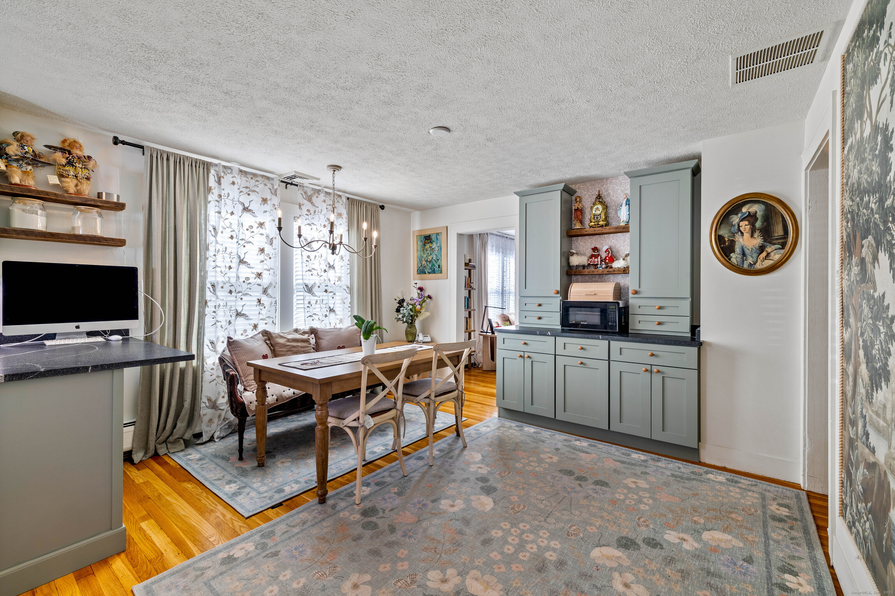 552 Laurel Hill Road Norwich, CT 06360 - Photo 13 of 40 a living room with furniture a flat screen tv and a window