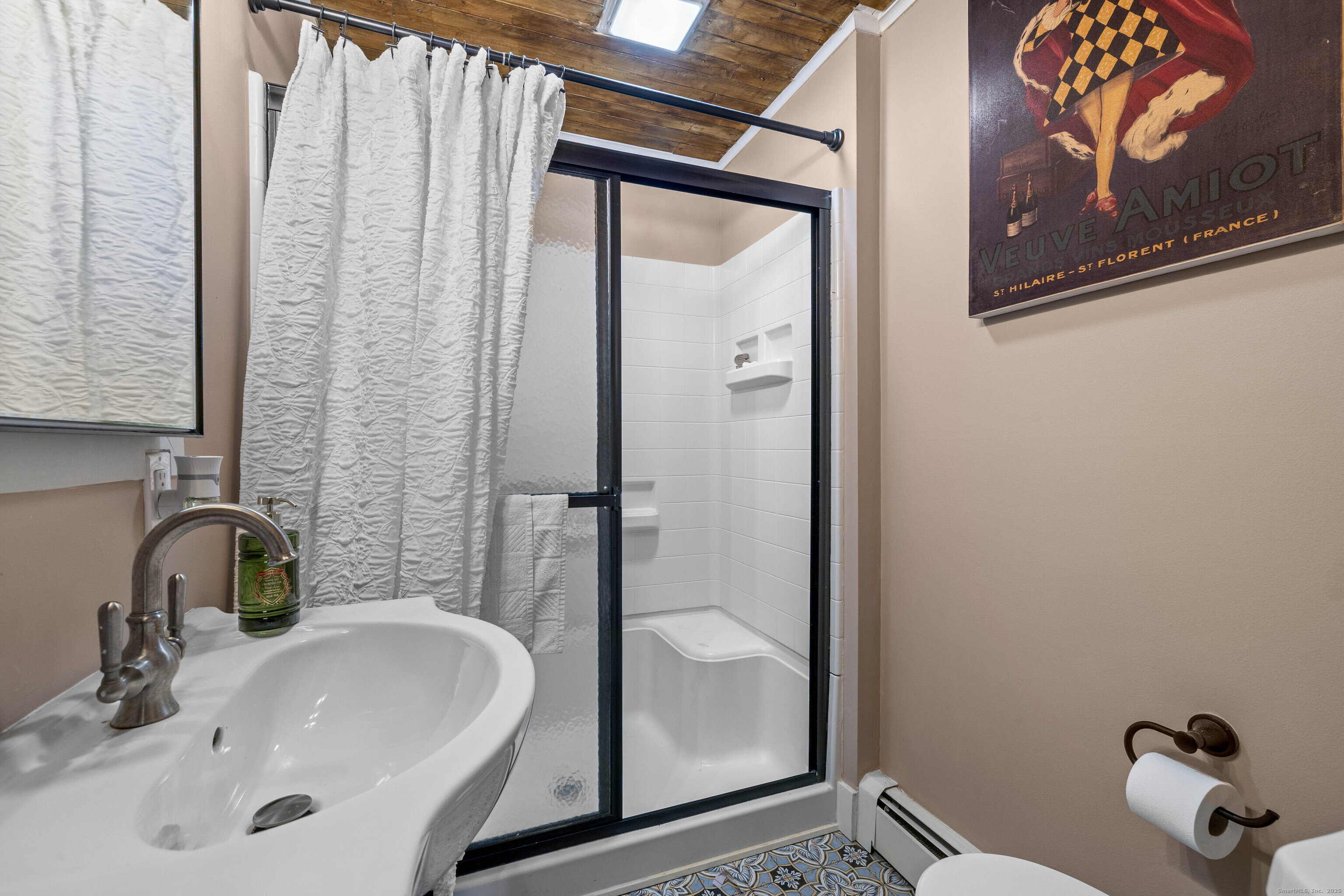 552 Laurel Hill Road Norwich, CT 06360 - Photo 14 of 40 a bathroom with a sink and a mirror