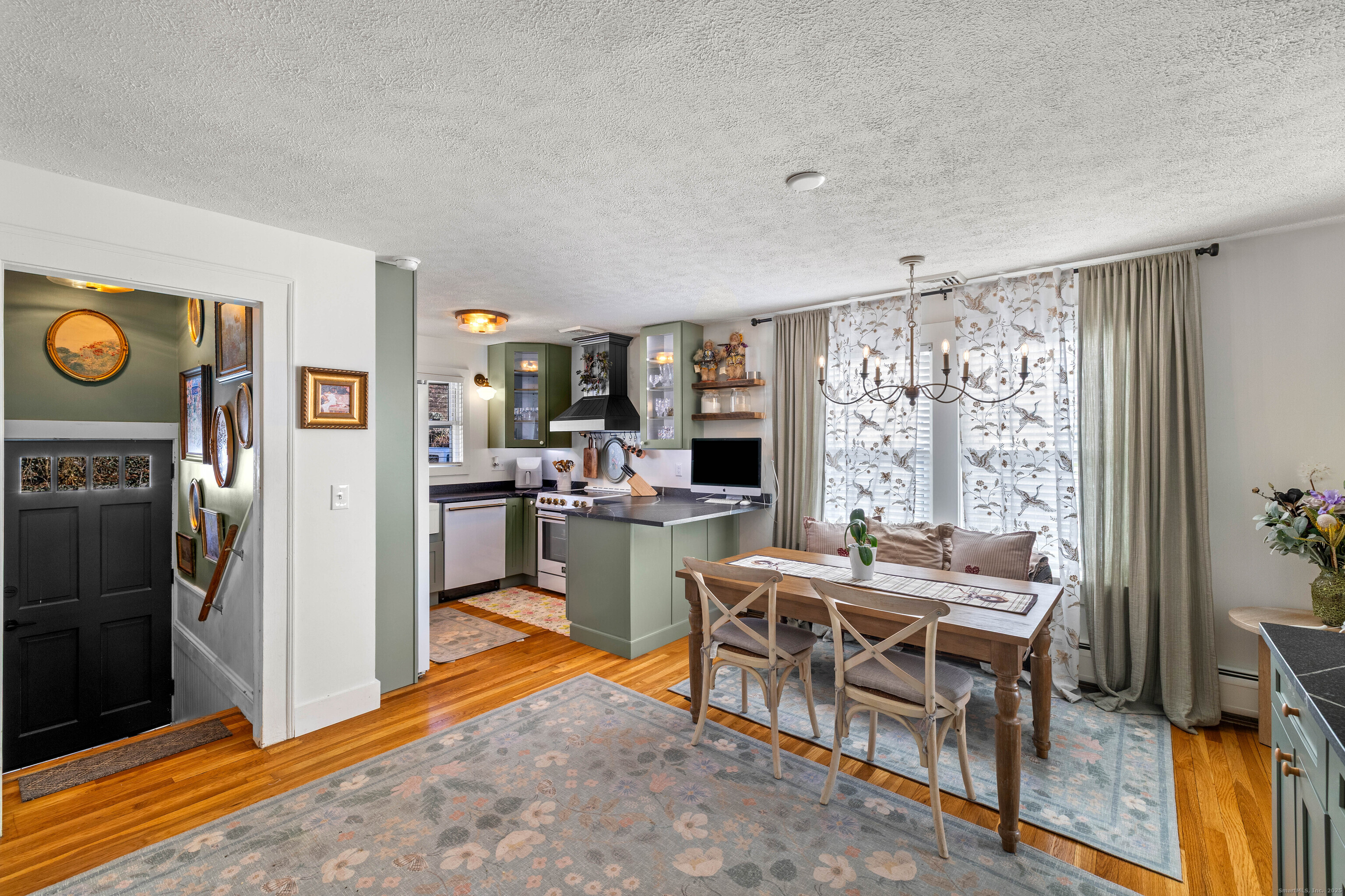 552 Laurel Hill Road Norwich, CT 06360 - Photo 16 of 40 a view of a dining room with furniture window and outside view