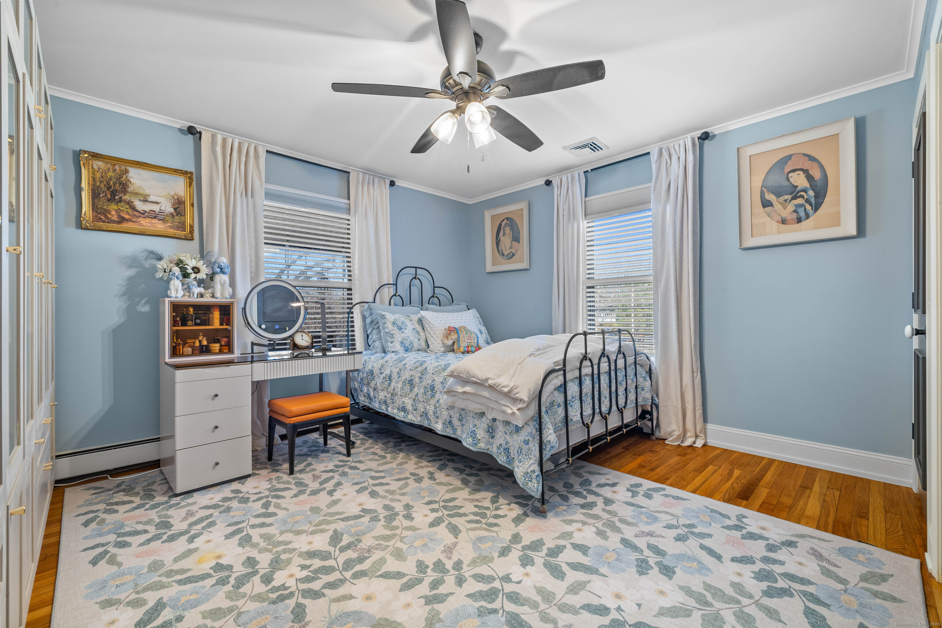 552 Laurel Hill Road Norwich, CT 06360 - Photo 24 of 40 a bedroom with a bed and a chandelier