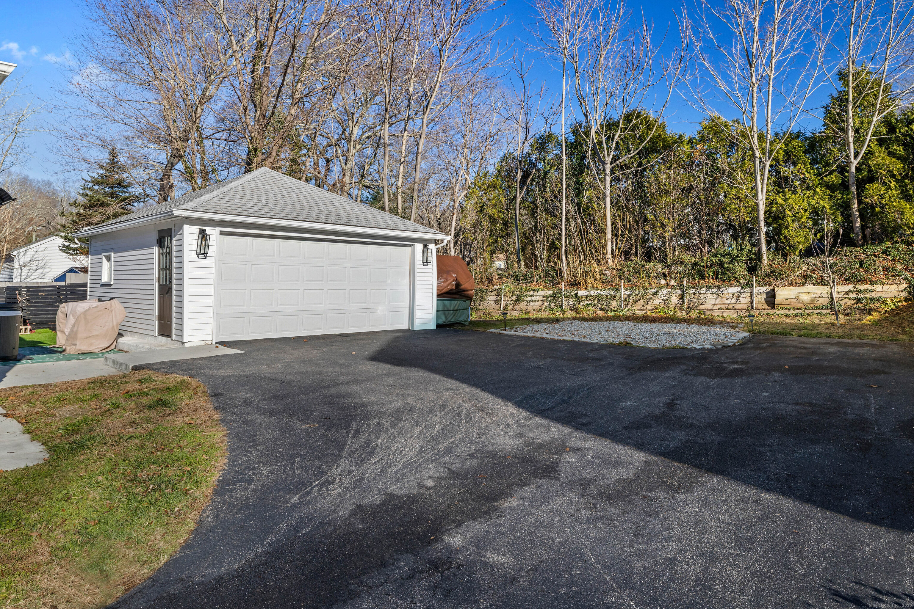 552 Laurel Hill Road Norwich, CT 06360 - Photo 33 of 40 a front view of a house with a yard and garage