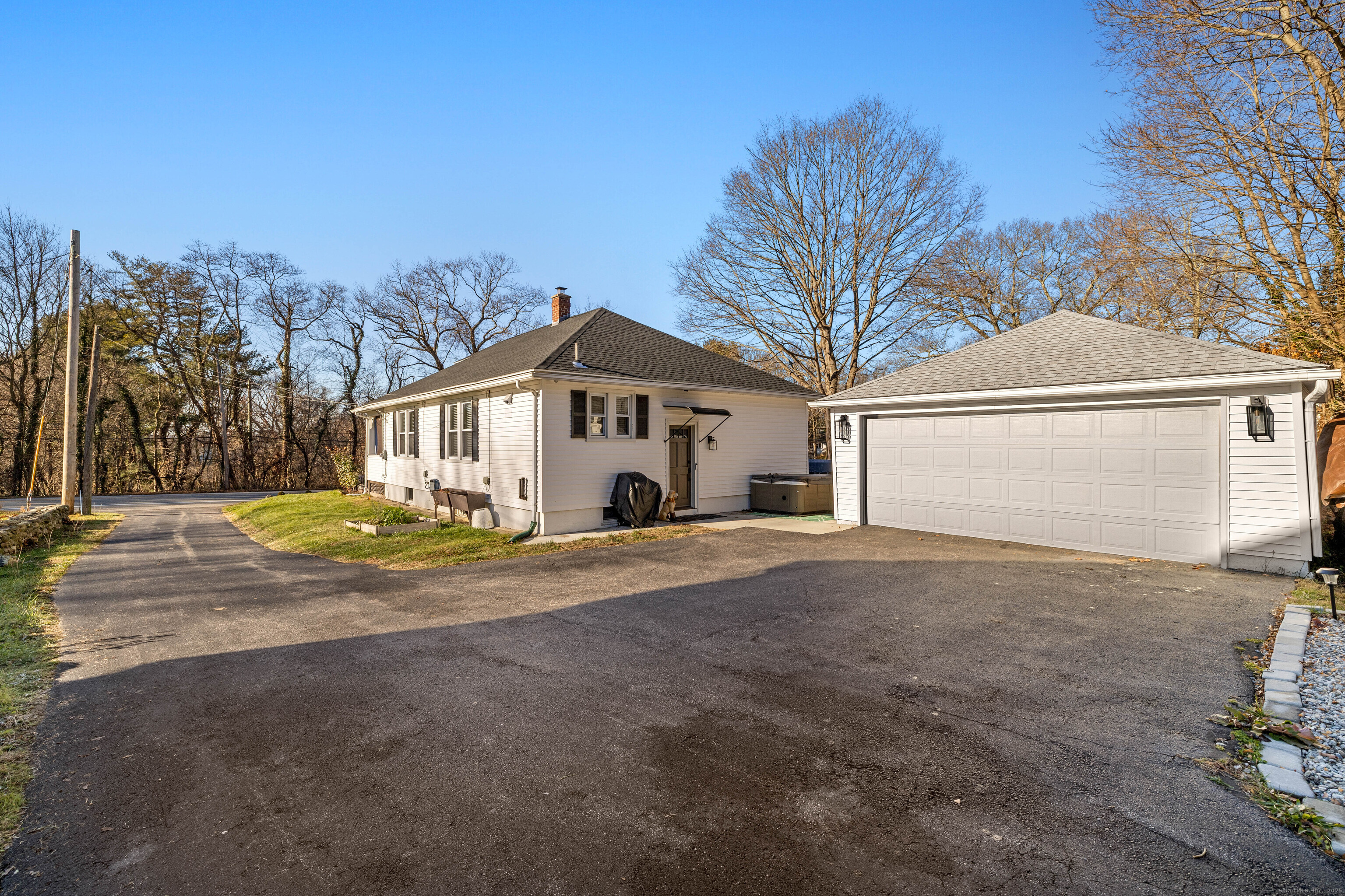 552 Laurel Hill Road Norwich, CT 06360 - Photo 35 of 40 a view of a house with a yard and garage