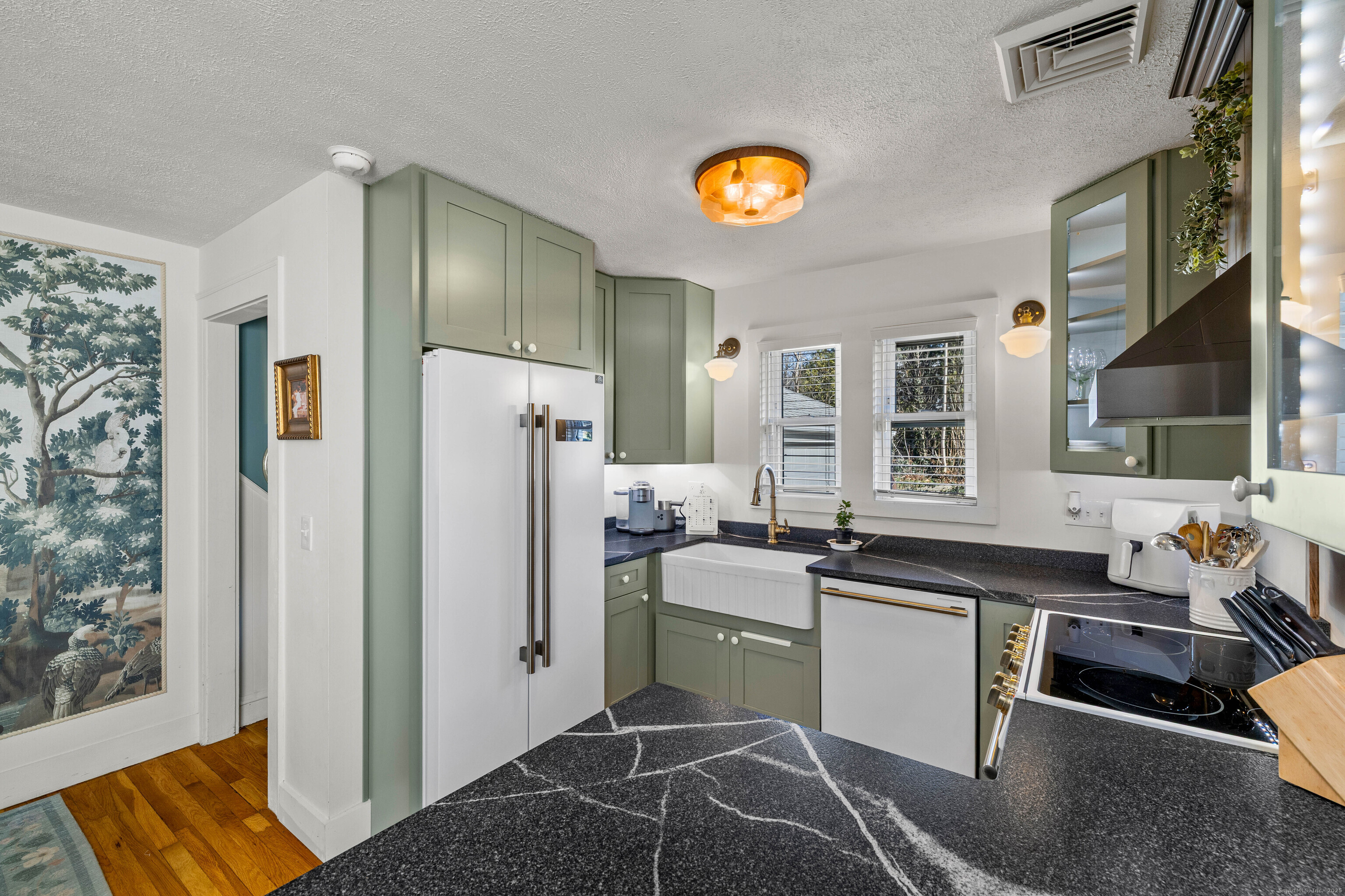 552 Laurel Hill Road Norwich, CT 06360 - Photo 4 of 40 a kitchen with stainless steel appliances granite countertop a sink stove and refrigerator