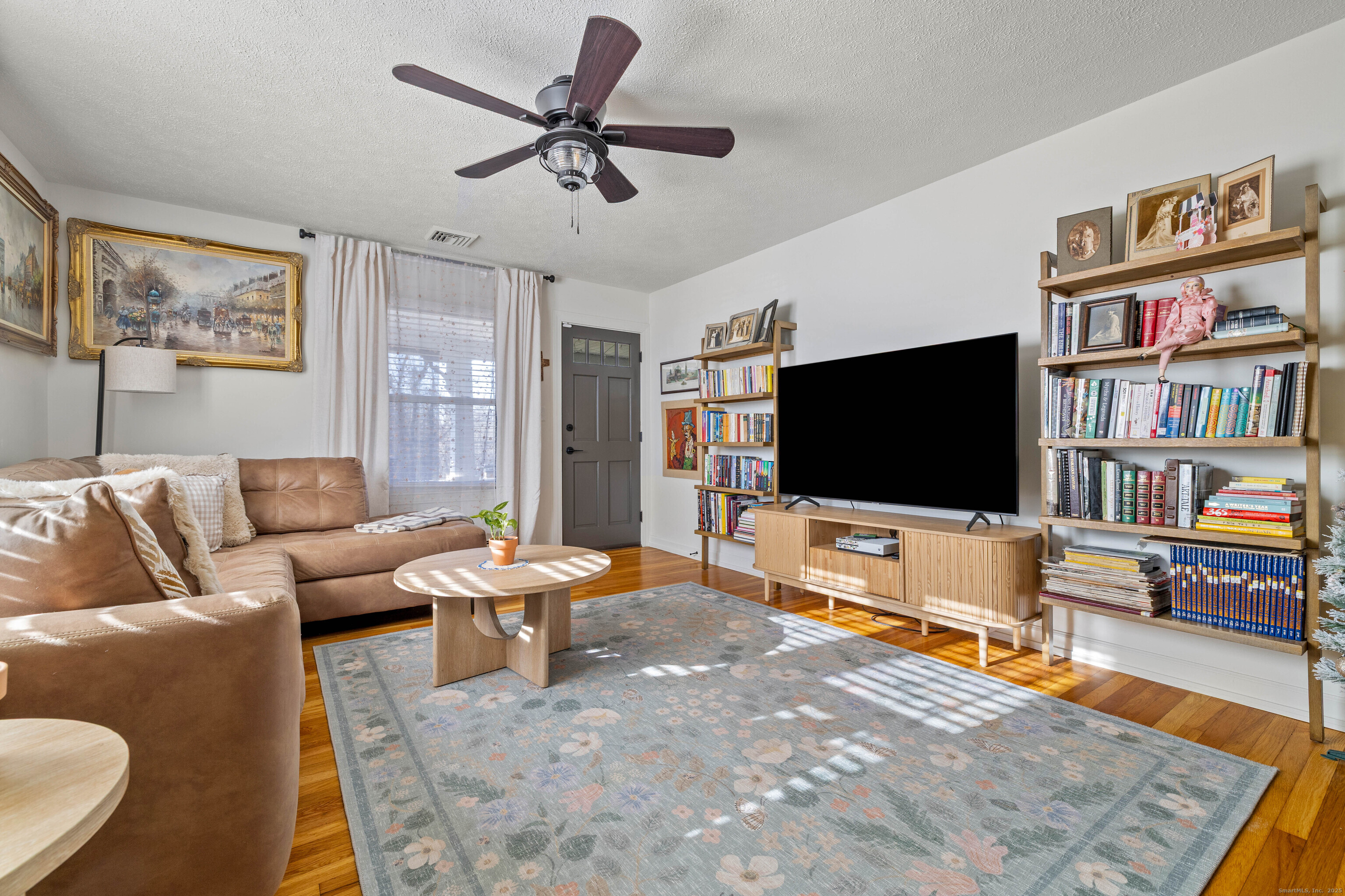 552 Laurel Hill Road Norwich, CT 06360 - Photo 5 of 40 a living room with furniture and a flat screen tv
