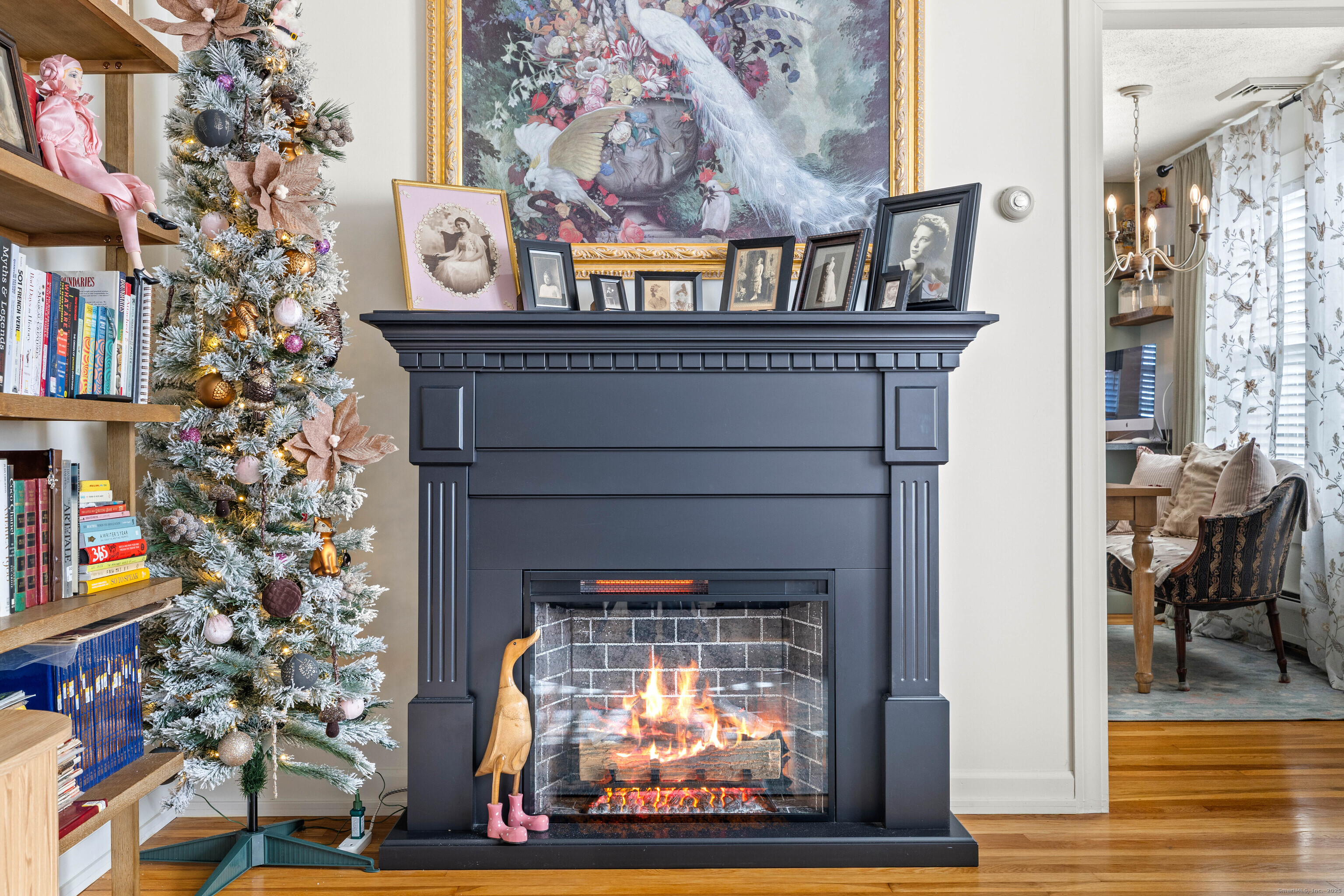 552 Laurel Hill Road Norwich, CT 06360 - Photo 6 of 40 a fireplace with lots of flowers on it