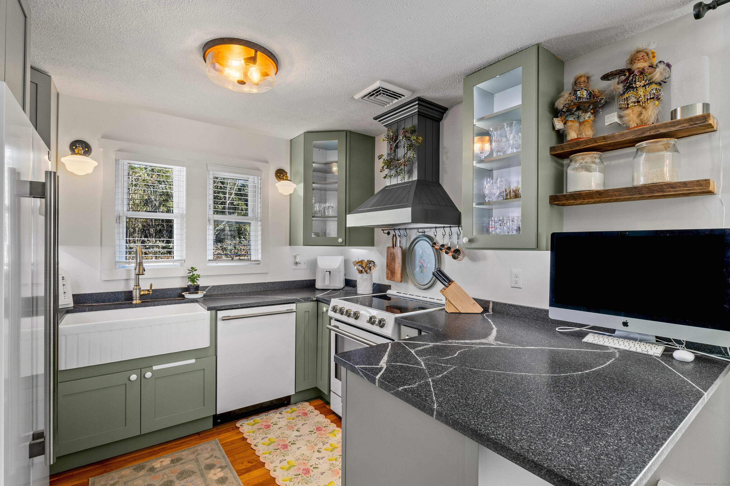 552 Laurel Hill Road Norwich, CT 06360 - Photo 10 of 40 a kitchen with stainless steel appliances granite countertop a sink and a microwave