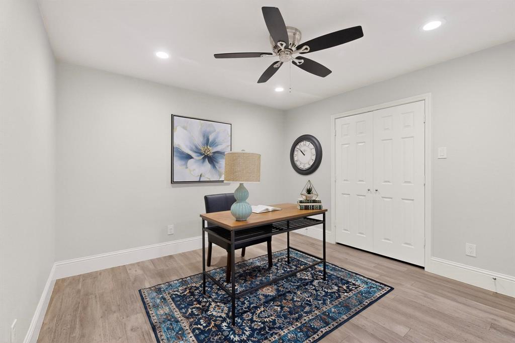 7625 Querida Lane Dallas, TX 75248 - Photo 12 of 32 a view of a workspace room with furniture and wooden floor