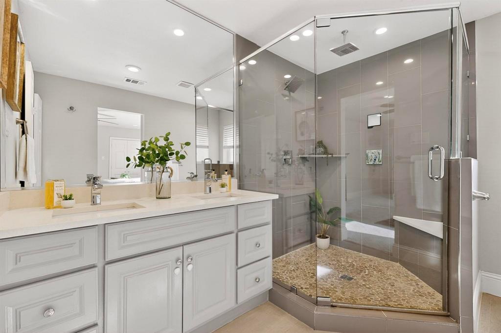 7625 Querida Lane Dallas, TX 75248 - Photo 15 of 32 a view of bathroom with a sink and mirror