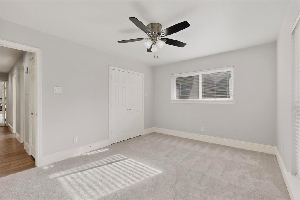 7625 Querida Lane Dallas, TX 75248 - Photo 17 of 32 a view of an empty room with a window