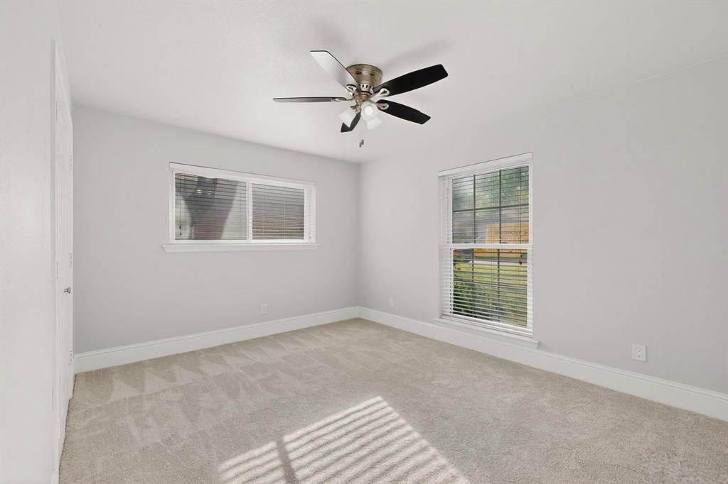 7625 Querida Lane Dallas, TX 75248 - Photo 19 of 32 a view of an empty room with a window