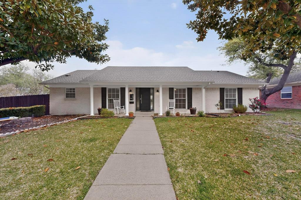 7625 Querida Lane Dallas, TX 75248 - Photo 2 of 32 front view of a house with a yard