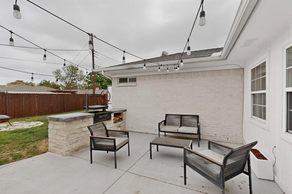 7625 Querida Lane Dallas, TX 75248 - Photo 24 of 32 a roof deck with table and chairs