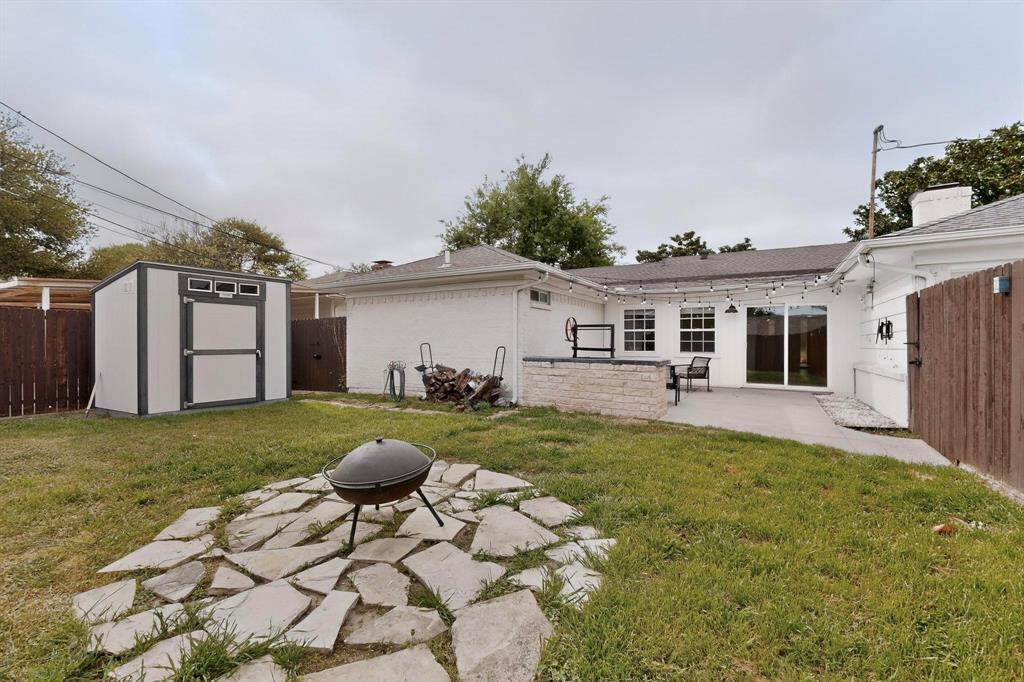 7625 Querida Lane Dallas, TX 75248 - Photo 26 of 32 a view of a house with backyard and porch