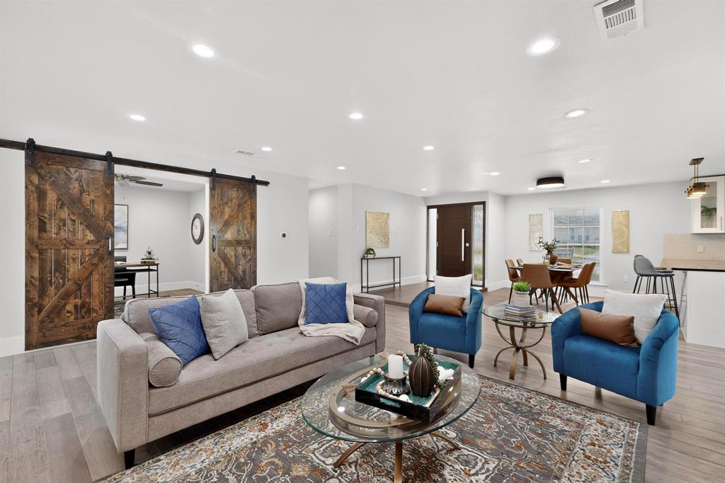 7625 Querida Lane Dallas, TX 75248 - Photo 10 of 32 a living room with furniture couches and kitchen view