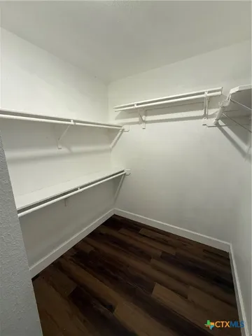 a view of a livingroom with wooden floor