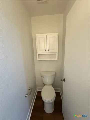 a bathroom with a toilet