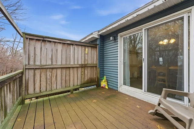 a view of a balcony with wooden floor