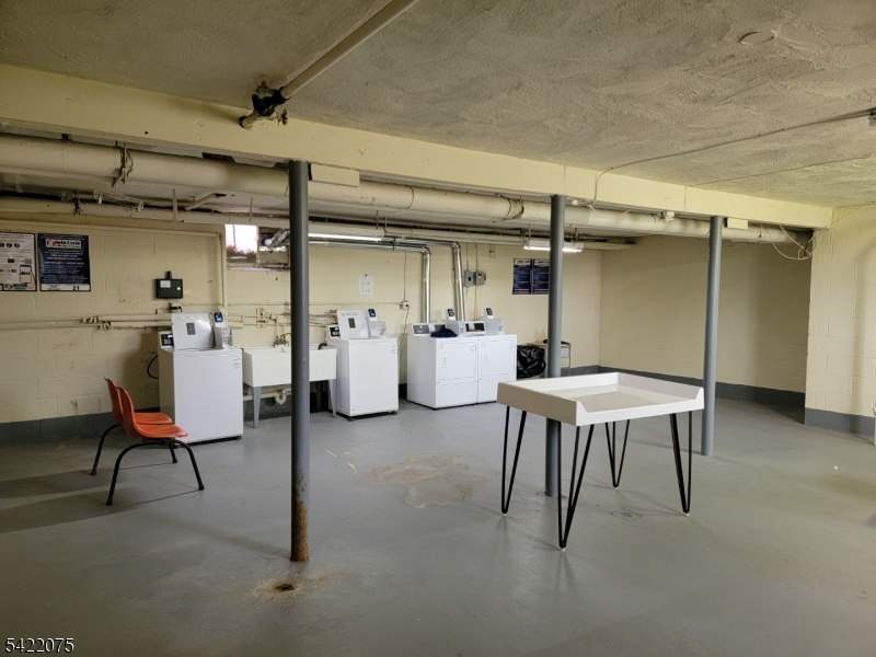 21C Troy Drive Springfield, NJ 07081 - Photo 16 of 17 a view of a chairs and table in a room