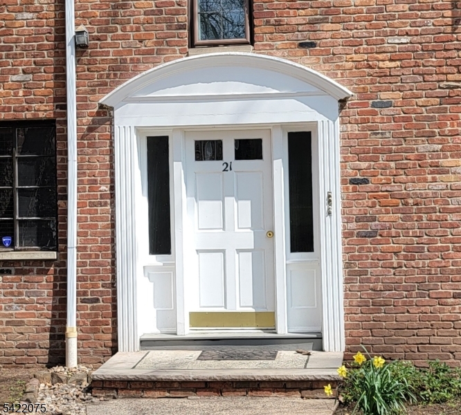 21C Troy Drive Springfield, NJ 07081 - Photo 3 of 17 a front view of a house with a window