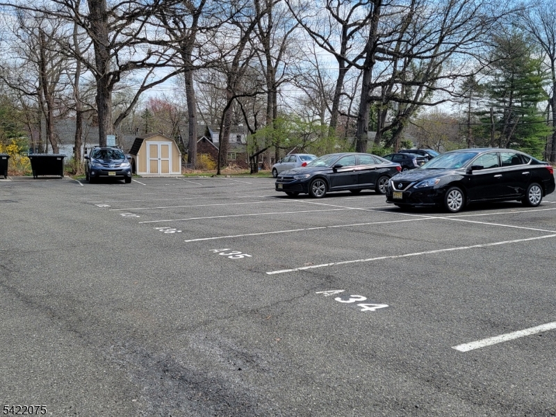 21C Troy Drive Springfield, NJ 07081 - Photo 6 of 17 a view of cars parked on a city street