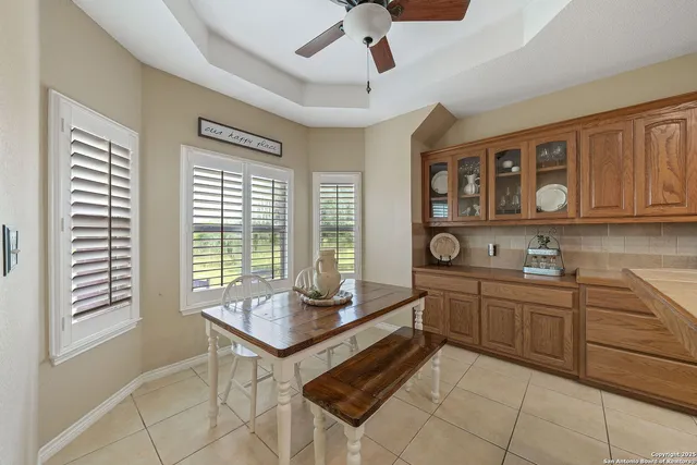 a kitchen with stainless steel appliances granite countertop a stove and cabinets