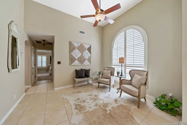 a living room with furniture and a window