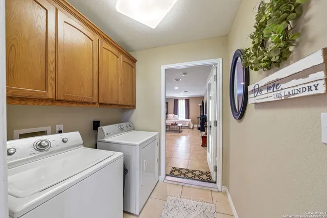 a view of storage and utility room with washer and dryer