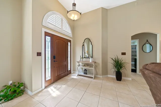 a view of living room with furniture and potted plant