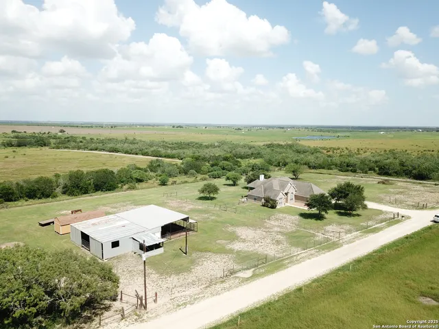 an aerial view of a garden with an ocean