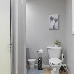 a a bathroom with a toilet and a sink