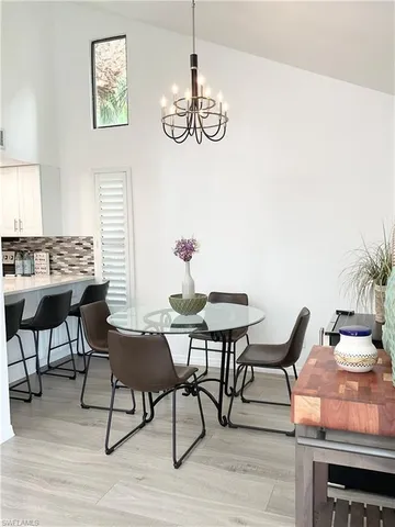 a kitchen with a stove a sink and a refrigerator