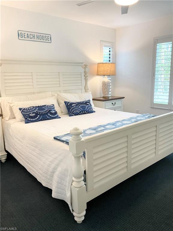 964 8th Avenue South, Unit B2 Naples, FL 34102 - Photo 27 of 37 a bedroom with a bed and window