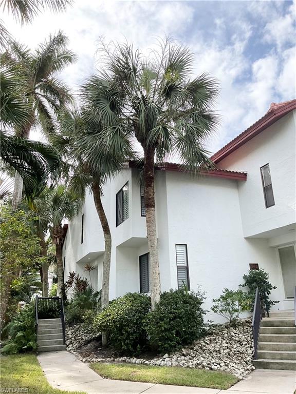 964 8th Avenue South, Unit B2 Naples, FL 34102 - Photo 3 of 37 a front view of a house with a tree