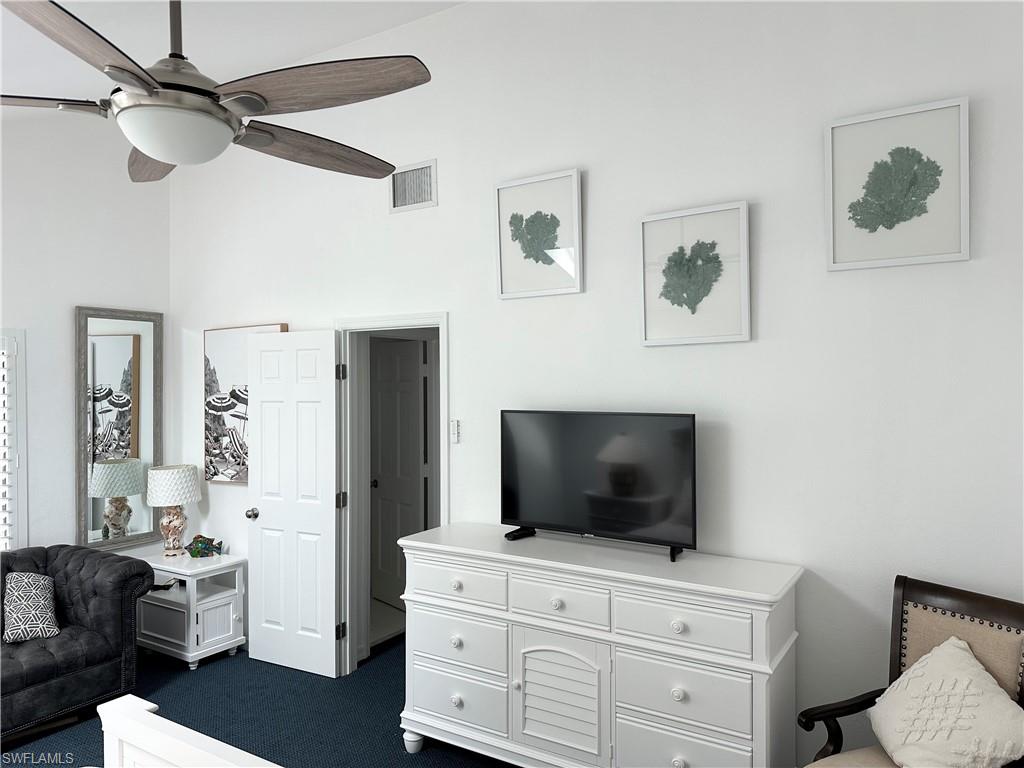 964 8th Avenue South, Unit B2 Naples, FL 34102 - Photo 31 of 37 a living room with furniture and a flat screen tv