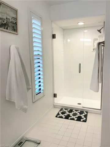 a bathroom with a toilet and a mirror