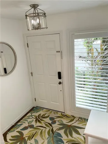 a view of a room with wooden floor and balcony