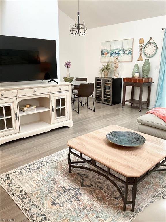 964 8th Avenue South, Unit B2 Naples, FL 34102 - Photo 6 of 37 a living room with furniture and a flat screen tv