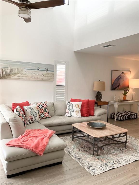 964 8th Avenue South, Unit B2 Naples, FL 34102 - Photo 9 of 37 a living room with furniture and a rug