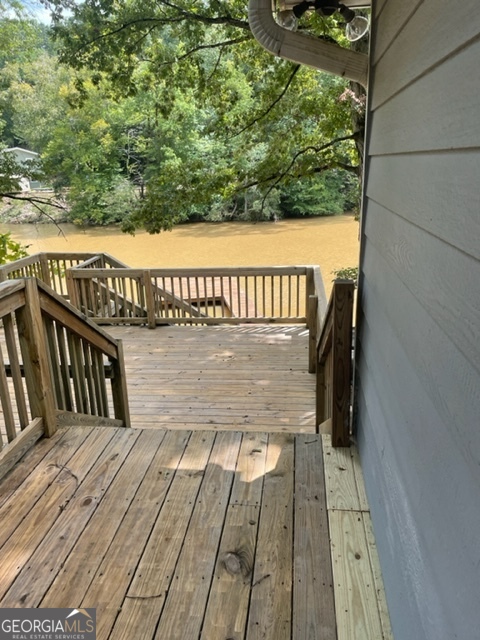 132 Collins Road Jackson, GA 30233 - Photo 30 of 39 a view of balcony with wooden floor and fence