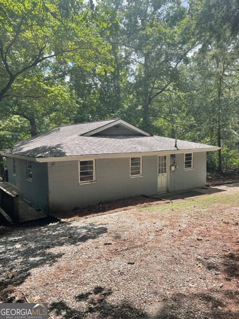 132 Collins Road Jackson, GA 30233 - Photo 3 of 39 a front view of a house with a yard