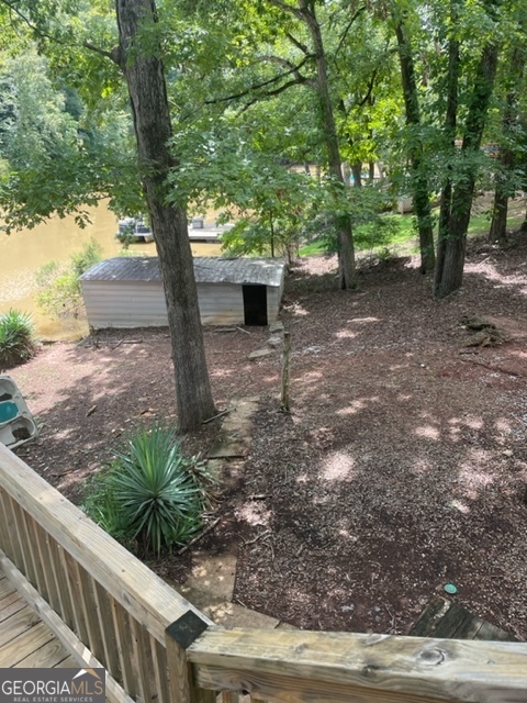 132 Collins Road Jackson, GA 30233 - Photo 32 of 39 a view of a yard with plants and trees