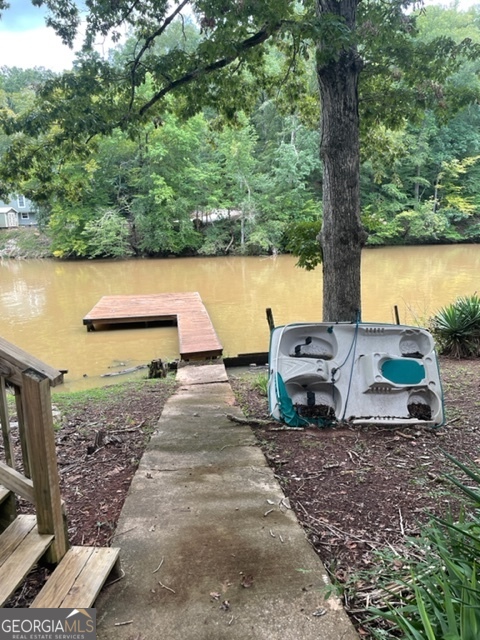 132 Collins Road Jackson, GA 30233 - Photo 34 of 39 a view of a backyard with water fountain and sitting space